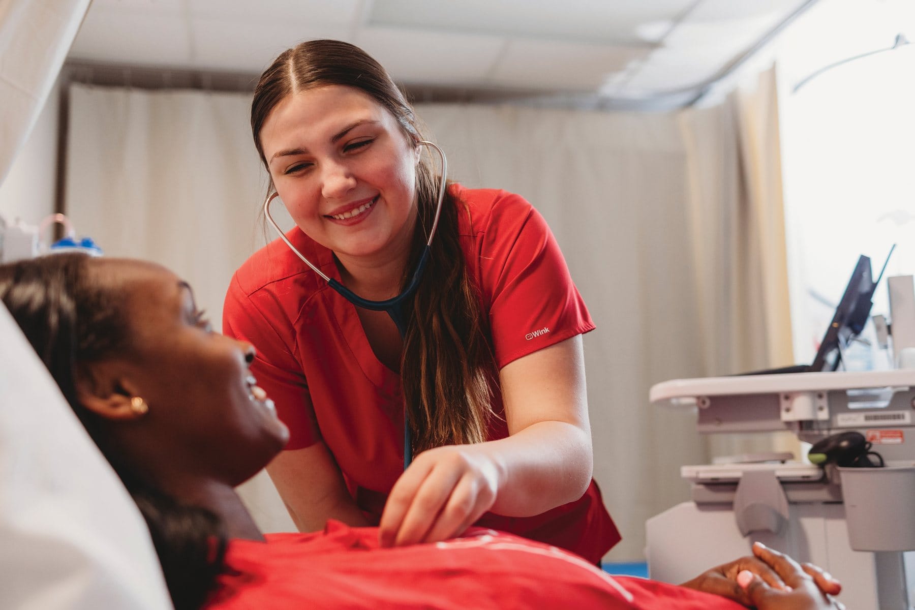 NDSCS nursing student with a patient